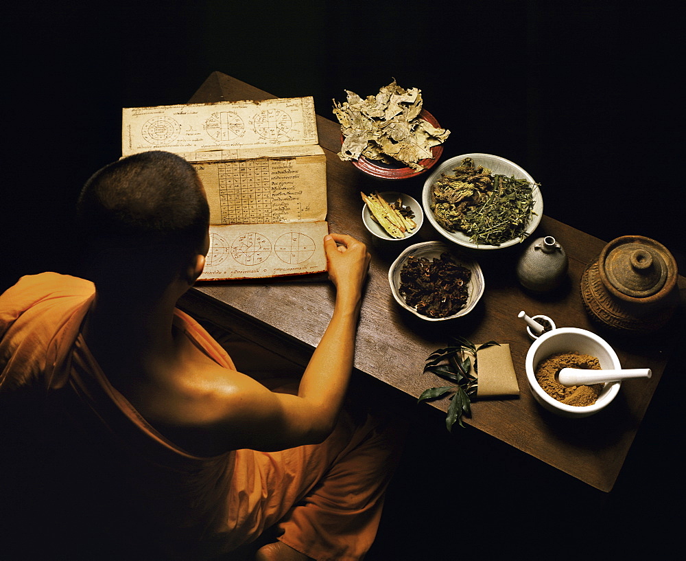 Thai monk preparing herbal medicines, Thailand, Southeast Asia, Asia